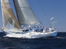 Racing Sailboat with Crew on Ocean